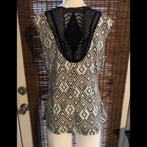 Sleeveless blouse by Alyx. Crotchet back.